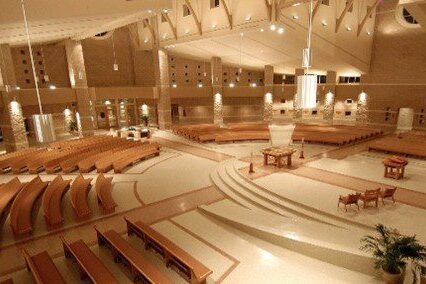 a sanctuary with curved pews