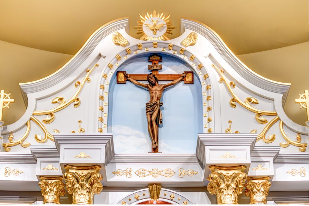 The large gold and white reredos in the Saint Rocco Catholic Church in Avondale, PA