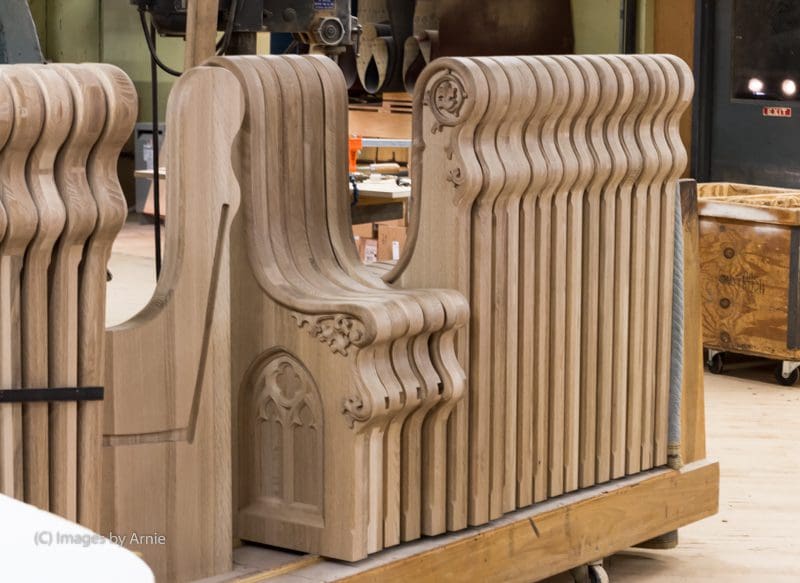 Panels of custom made wooden pew ends.